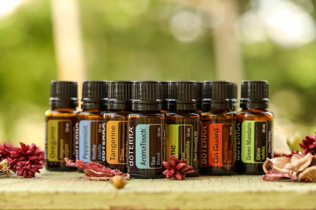 Essential oil bottles arranged with lavender, eucalyptus and citrus
